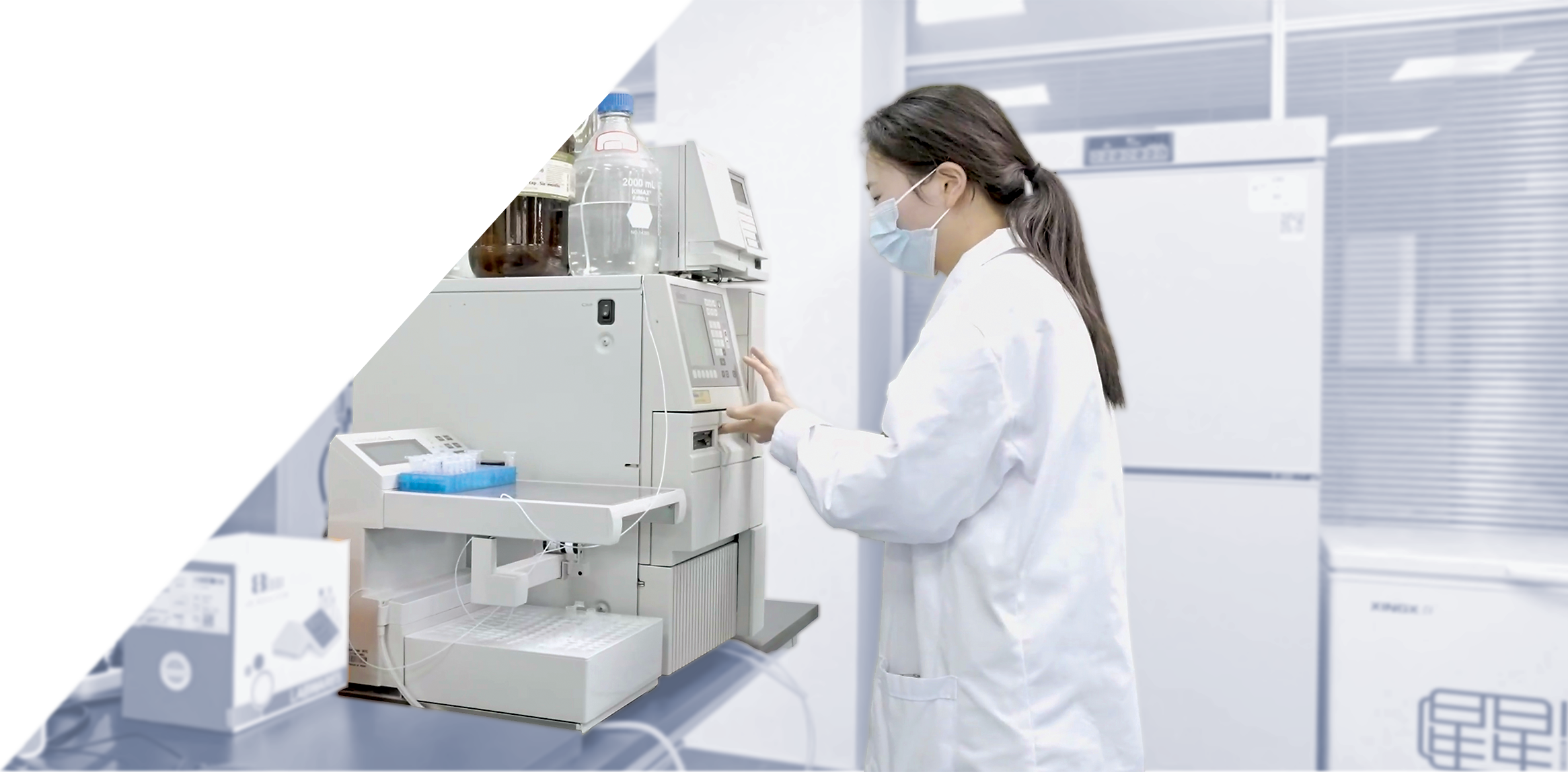 Female scientist operating analysis machine