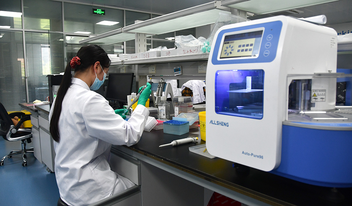 Woman working at laboratory bench