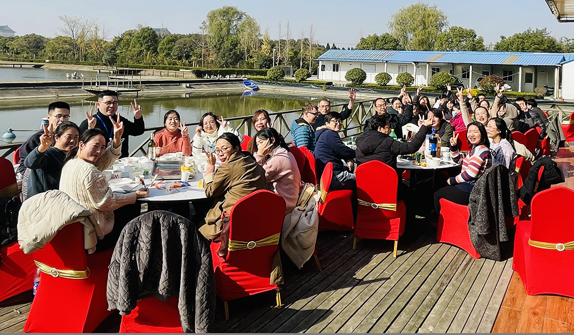 Ractigen team members enjoying a meal served outdoors